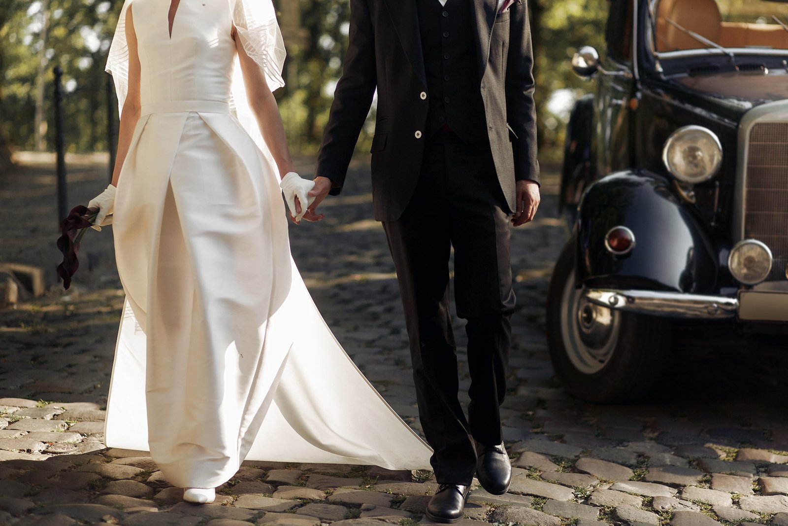 Bride and groom at weddinggoing together in the yard of the church in video